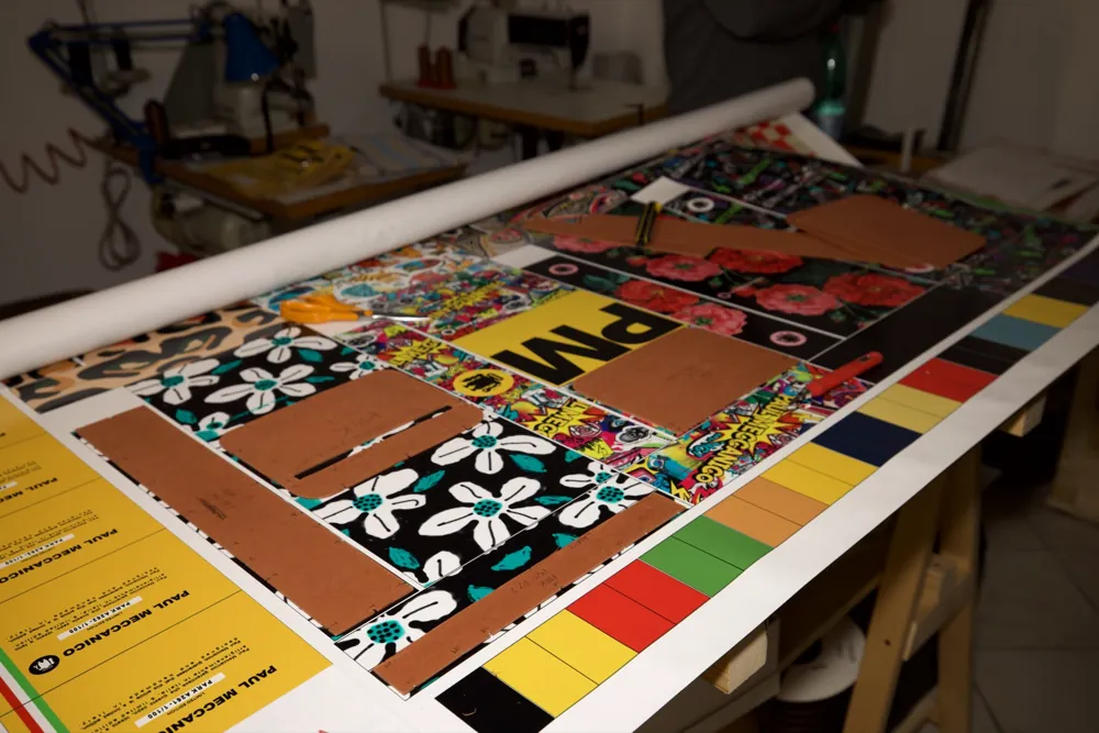 Printed sheets and patterns laid out on the cutting table